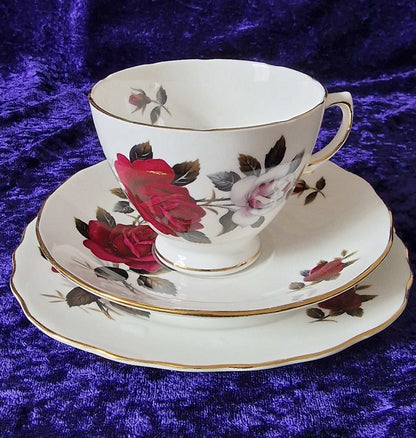 Elegant Colclough "Amoretta Rose" 18-piece tea set with china cups and saucers decorated with roses.
