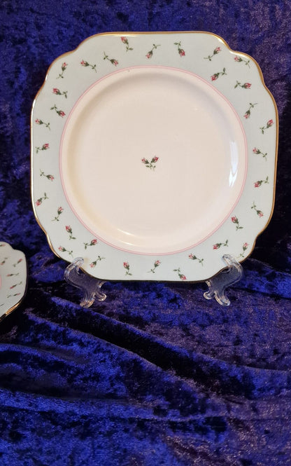 Charming Royal Albert 2004 Rose Buds plates adorned with pink roses, suitable for cake or side portions