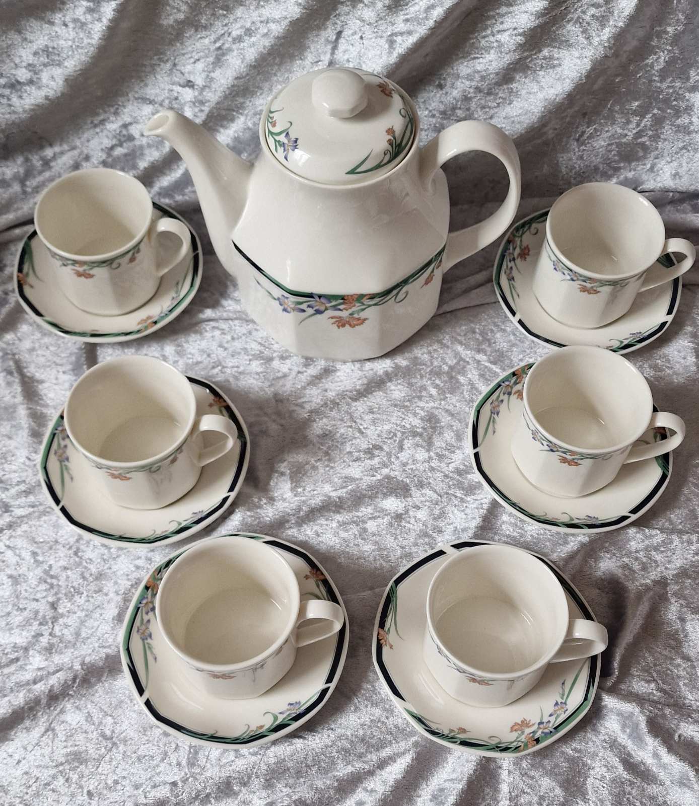 Royal Doulton tea set with six elegant tea cups and matching saucers.