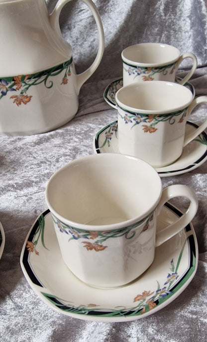 Royal Doulton tea set with six elegant tea cups and matching saucers.