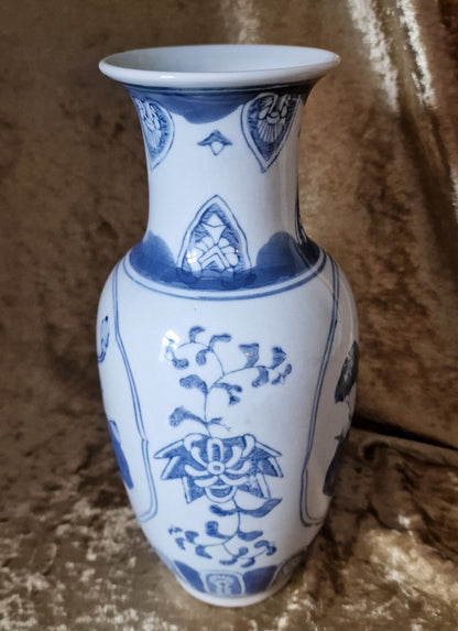 Blue and white vase with bird design, perfect for adding a touch of elegance to any room decor.