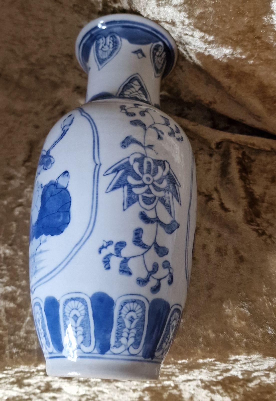 Blue and white vase with bird design, perfect for adding a touch of elegance to any room decor.